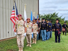 Veterans lined up at the Honey Springs Battlefield with flags in hand during the Battle of Honey Springs memorial service held in July