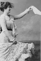 A women holds out a handkerchief. LOC image