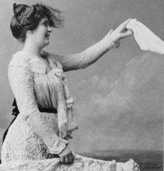 A women holds out a handkerchief. LOC image