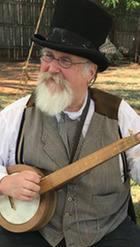 Photos of the parlor and exterior of the A.J. Seay Mansion, and Wayne Cantwell playing banjo. A guitar graphic and the Chisholm museum logo