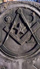 Gravestione slate with images relating to the Masons