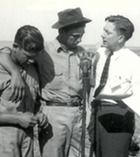 Two CCC enrolless talk into a microphone for a radio brodcast during a Soil Conservation Service and Youth Day 7/16/41.