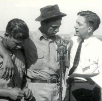 Two CCC enrolless talk into a microphone for a radio brodcast during a Soil Conservation Service and Youth Day 7/16/41.