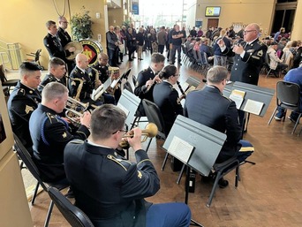 145th Army Band performing at the Oklahoma History Center. The photograph is taken behind the band members.