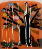 A series of colorful nightlights, created with glass, each with its own theme from abstract to floral, to a fall tree.