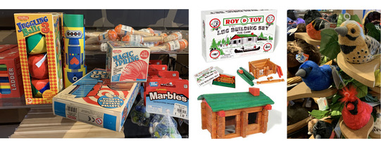Juggling Balls, a potato gun, a slinky, marrbles, and a "Roy Toy" Log Building Set, and a display full of plush birds at the OHC store