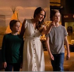 Visitors at the Oklahoma City History Center take in the "We Are Who We Were" exhibit at the ONEOK, Inc. gallery