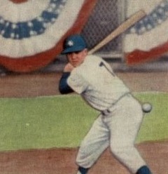 1959 Topps Baseball Card depicts Mickey Mantle at the plate with catcher and umpire in the background and patriotic bunting.