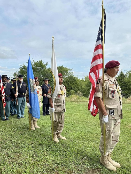 Honey Springs Battlefield Memorial Service with veterans carrying flags line up in a short formation at Honey Springs Battlefield
