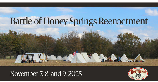 Reenactment dates Nov. 7, 8,9, and a series of small white canvas tents with reenactors gathered and walking through. 