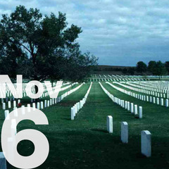 A graveyard with rows of marble stones and the date Nov 6