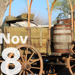 The wheels of a wooden buckboard wagon and the date Nov 8