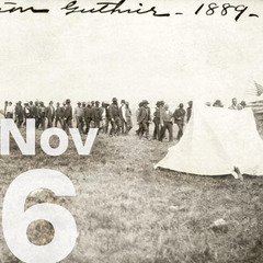 A group of men in a long line, waiting to cast the first votes in Guthrie, 1889, and the date November 6