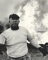 Myron Kinley after a close encounter with an oil-well fire