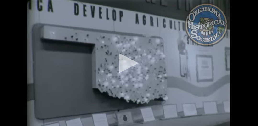 An agricultural map in a State Fair exhibit with light bulbs situated in the location of farms of Oklahoma in 1962.