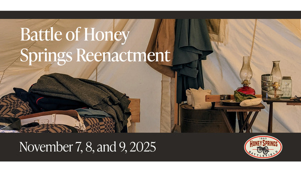 Honey Springs Battlefield reenactment scene in a tent with the Honey Springs Battlefield logo and dates of the event