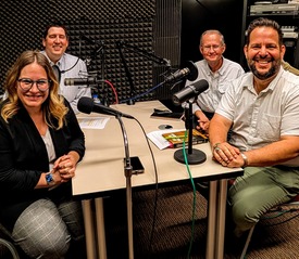 A photo taken in the A Very OK Podcast Recording studio with Trait Thompson, Bob Blackburn, Nicole Harvey, and Chantry Banks