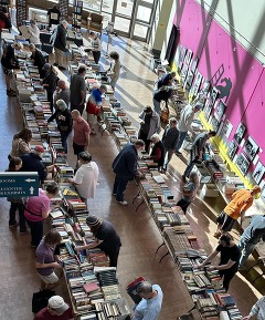 Crowds of people shopping for books at the Research Center Book Sale in the Oklahoma History Center.