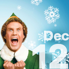 Will Ferrell dressed in an elf costume with an enthusiastic expression.