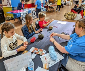Children gathered at a table making an art project at the Oklahoma History Center.