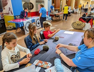 Children gathered at a table making an art project at the Oklahoma History Center.