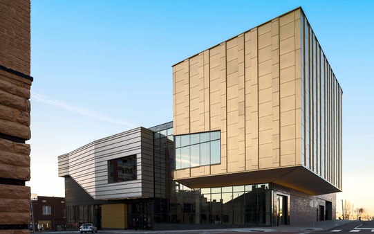 The Oklahoma Museum of Popular Culture museum building completed, with ornamental glass and steel panels. At its tallest point is 75 feet.
