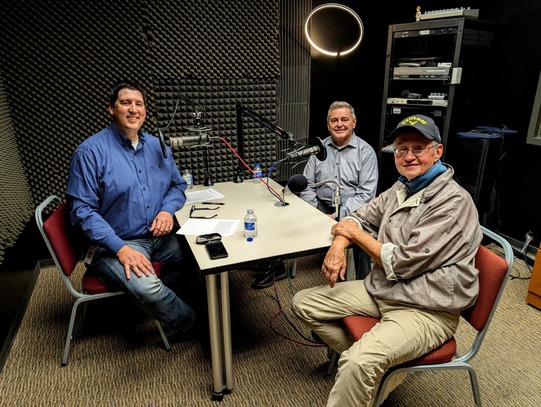 Trait Thompson, Don Beck, and Bob Blackburn seated at a table in the podcast recording studio at OHS.