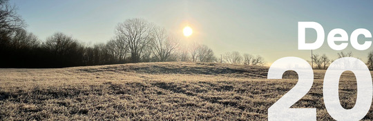 The Ward mound at Spiro Mounds Archaeological Center. Frost is seen on the grass in the foreground, and the sun setting low above the mound