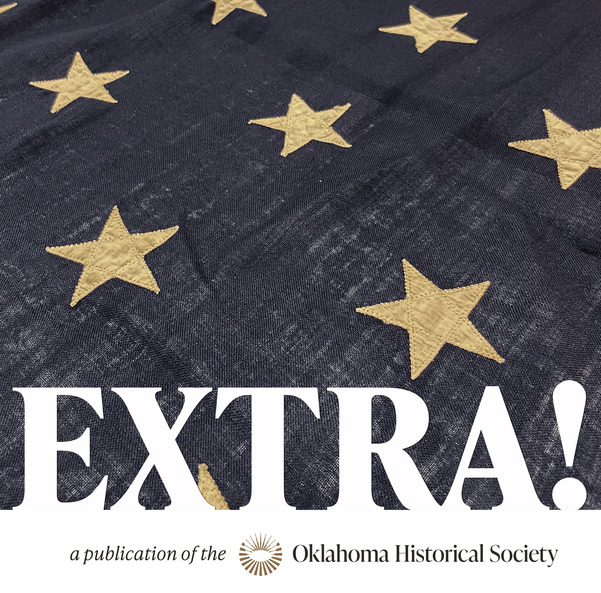 Detail of the star field of an antique American flag and the word "EXTRA" imposed in white letters over the image