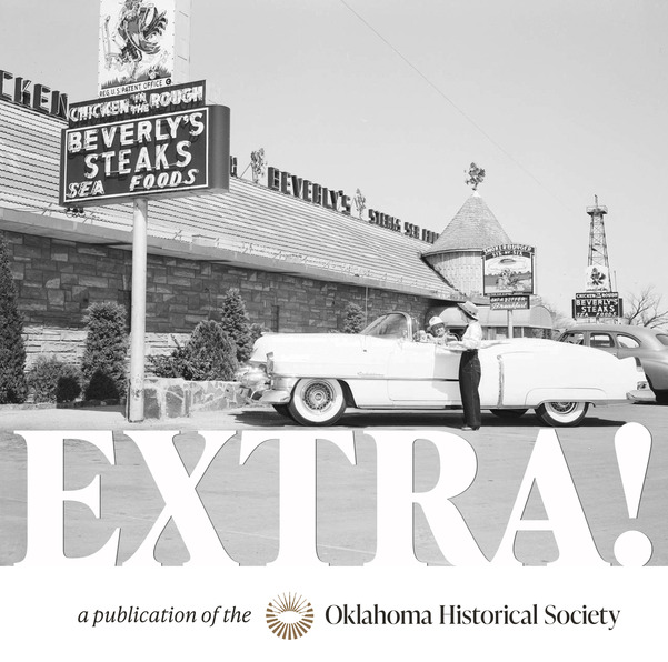 A car hop waits on a man in a large vintage sedan from the 1940s. He is parked outside of Beverly's Chicken in the Rough restaurant.