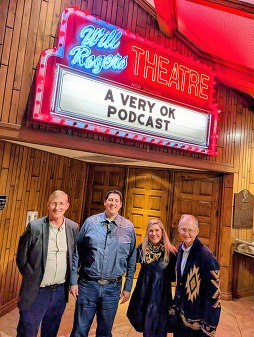 Trait Thompson, Tad Jones, Jennifer Rogers Etcheverry, and Dr. Bob Blackburn stand at the entrance to the Will Rogers Theatre.