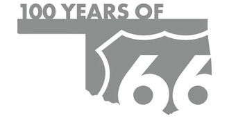 The state of Oklahoma formed into a stylized graphic with the Route 66 shield in white lettering on the shape of the state