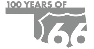 The state of Oklahoma formed into a stylized graphic with the Route 66 shield in white lettering on the shape of the state