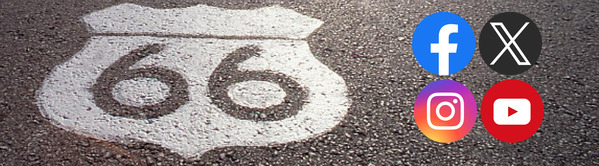 A painted Route 66 shield marks the asphalt of a portion of the historic highway. Social media icons are grouped to the right