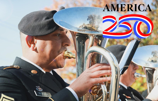 A member of the US Army 395th band, playing a baritone horn, standing in a line of other musicians. America 250 logo