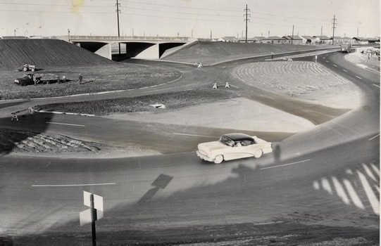 Cars and trucks drive along Route 66