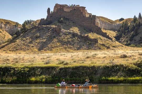 A canoe being paddled on a portion of the Upper Missouri River Breaks national monument on the Lewis and Clark National Historic Trail