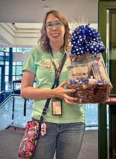 Teacher holding a gift basket