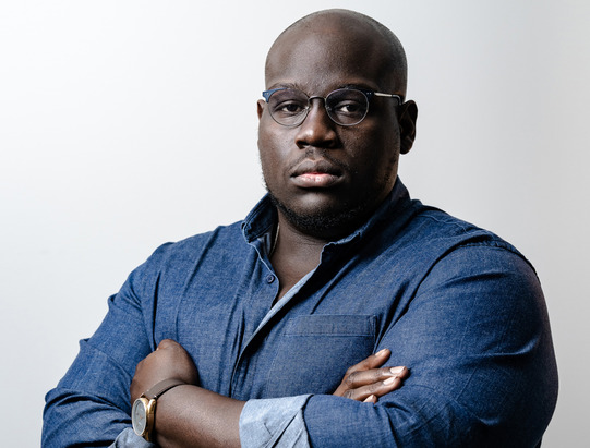 Black Moses book cover and a portrait of the author Caleb Gayle, wearing a denim shirt with his arms crossed.