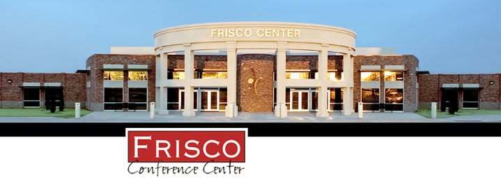 A large conference center with a modern large convex entrance with white columns and a circular alcove centered on the brick structure.