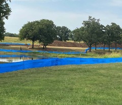 pile of dirt and construction barriers at Pawnee Bill Ranch