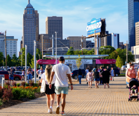 Couple walking to Scissortail Streetcar Stop.