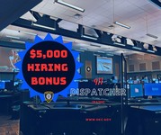 interior building with computer monitors and text that read $5,000 hiring bonus 911 dispatcher trainee