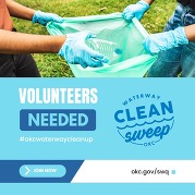 people holding open trash bag collecting water bottles