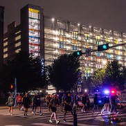 Memorial Marathon Participants walking infront of Arts Garage