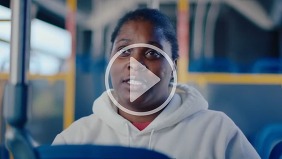 EMBARK customer onboard bus, doing a video interview.