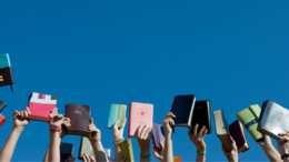 Thumbnail image of Bibles being held up in the air