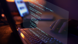 Decorative image: laptop with coding