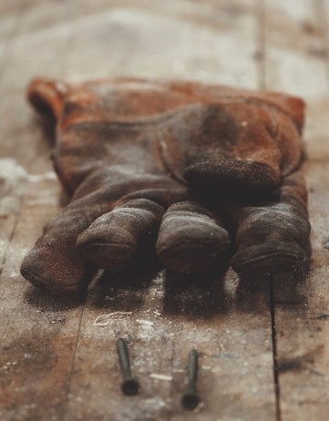 brown glove on wooden floor