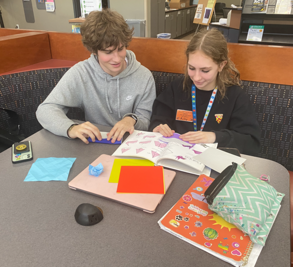 two students with origami